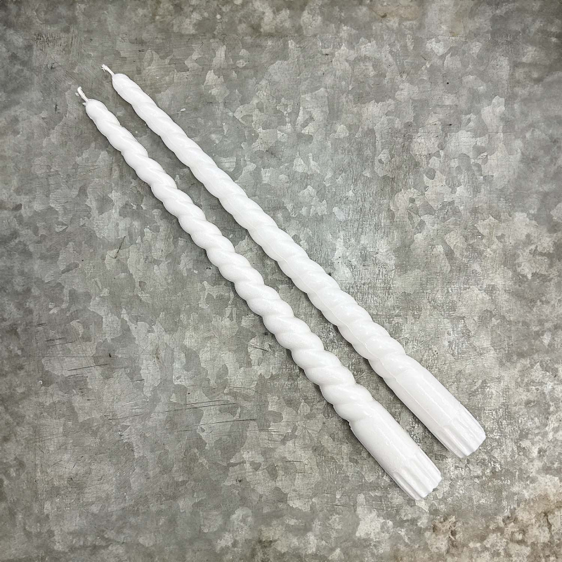 Long twisted dinner candles made of 100 % olive stearin